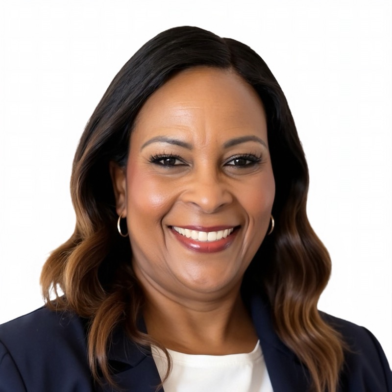 Vanessa Doobay, wearing a warm smile, with a soft neutral background